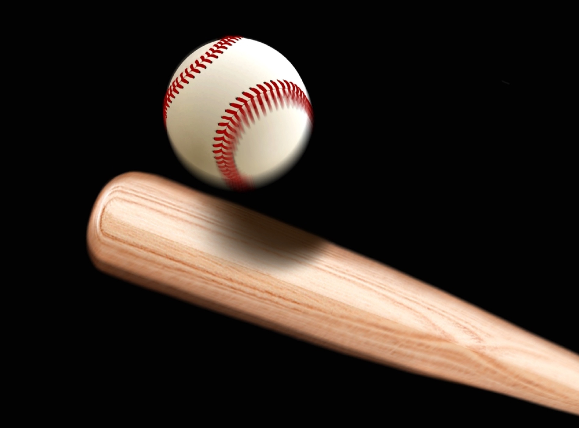 A Villain willow bat striking a leather ball